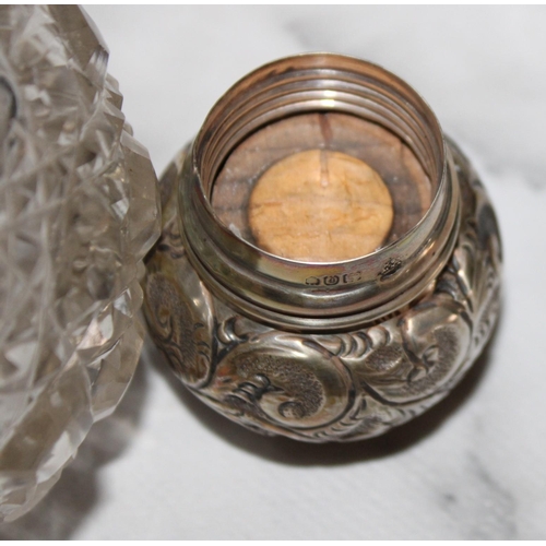 254 - Two Silver Hallmarked Topped Glass Containers
Damage Shown In Photos
Tallest 12cm