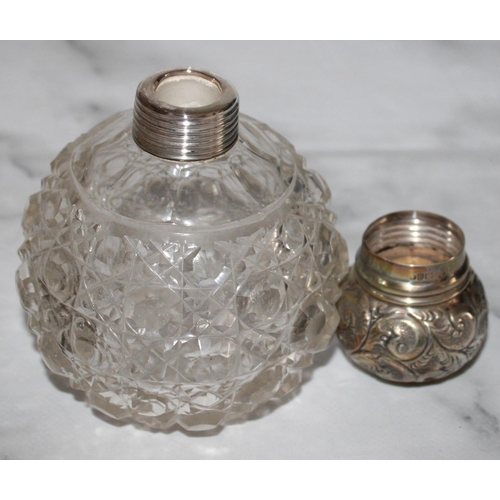 254 - Two Silver Hallmarked Topped Glass Containers
Damage Shown In Photos
Tallest 12cm