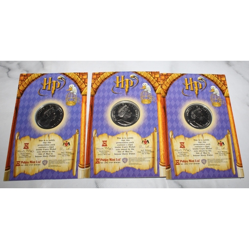 527 - Three 2002 Harry Potter Coins