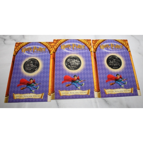 527 - Three 2002 Harry Potter Coins