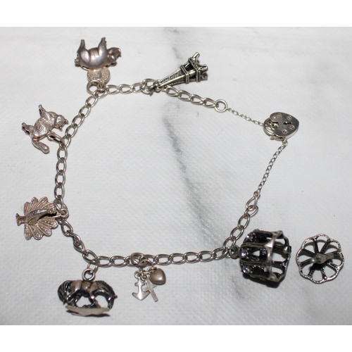 322 - Silver Hallmarked 925 Charm Bracelet With Charms (One Broken In Picture & Clasp Not Opening)