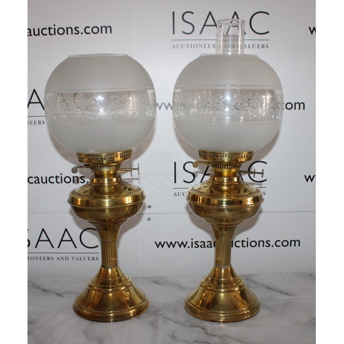 101 - Pair of Brass Oil Lamps with Shades

Standing 55cm Tall

One glass tube missing otherwise good condi... 