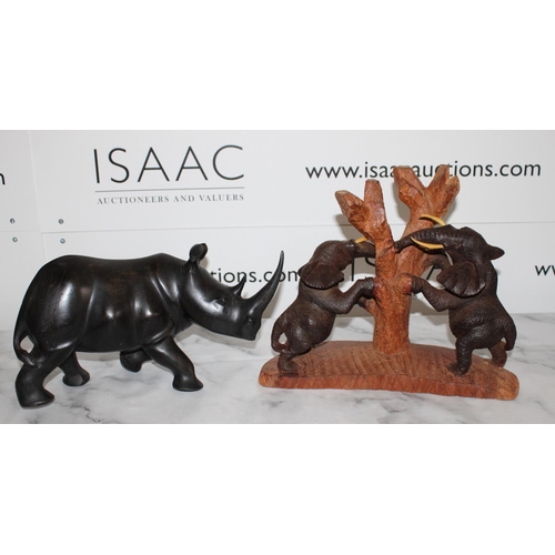 111 - Two African Wooden Carvings

Elephants and Rhino
Tallest 27cm