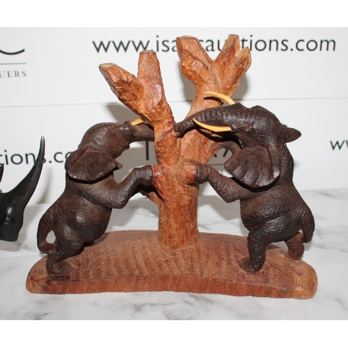 111 - Two African Wooden Carvings

Elephants and Rhino
Tallest 27cm