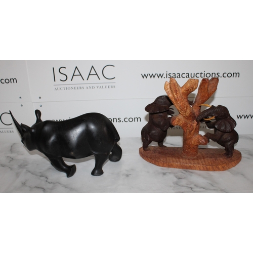 111 - Two African Wooden Carvings

Elephants and Rhino
Tallest 27cm