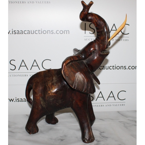 116 - Solid Wooden Carved Elephant - Stands 50cm Tall.

Collection Only.