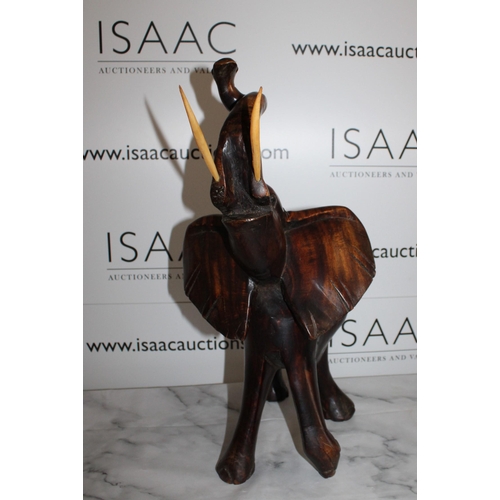 116 - Solid Wooden Carved Elephant - Stands 50cm Tall.

Collection Only.