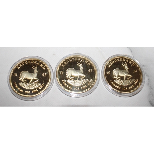 566 - Three Gold Plated South African Krugerrand Coins