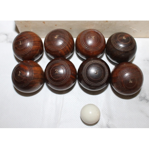 868 - Complete Set of Vintage Wooden Miniature Bowls with Jack.
Two sets of Bowls numbered 1 to 4.