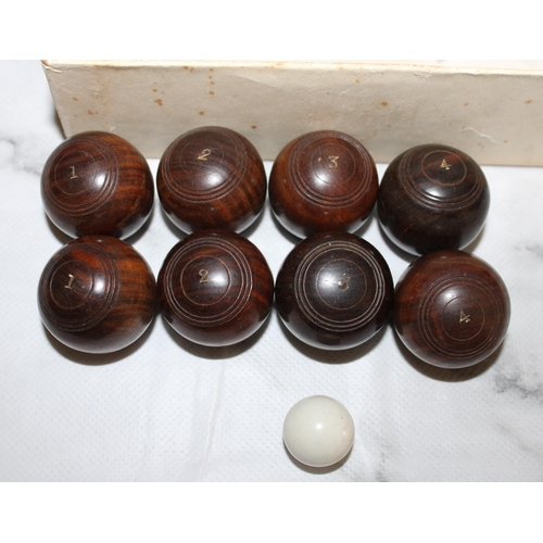 868 - Complete Set of Vintage Wooden Miniature Bowls with Jack.
Two sets of Bowls numbered 1 to 4.