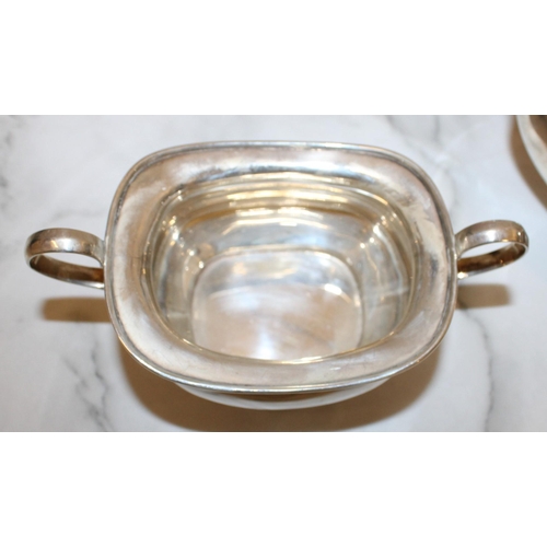 869 - Silver Hallmarked Tea Set Inc
Tea Pot
Sugar Bowl
Milk Jug
Total Weight-1050g
Good Condition