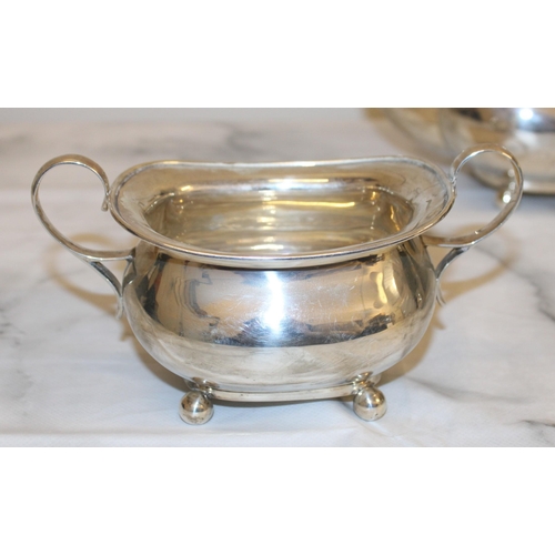 869 - Silver Hallmarked Tea Set Inc
Tea Pot
Sugar Bowl
Milk Jug
Total Weight-1050g
Good Condition