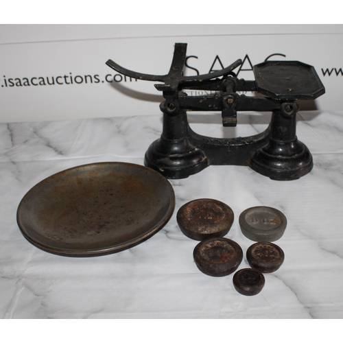 49 - Vintage Scales With Some Weights
Height-14cm
Width-26cm