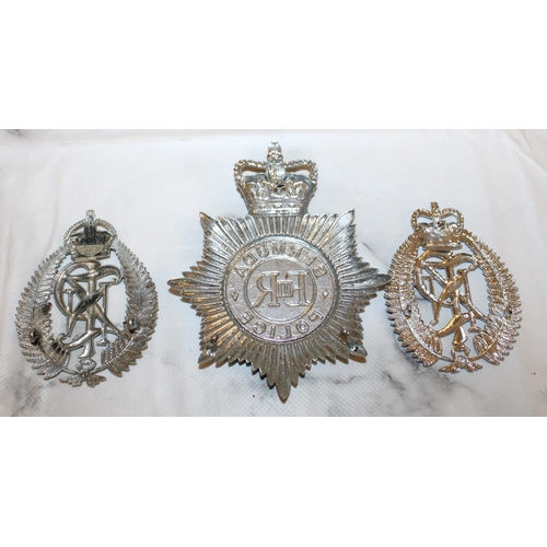 54 - Three Police Helmet Plate Badges  New Zealand and Bermuda

NZ Kings Crown 
NZ ERII Crown
Bermuda ERI...