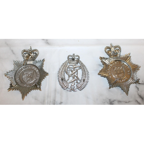 56 - Three ERII Police Helmet Plate Badges  

British Transport Police
New Zealand Police
Mid-Anglia Cons... 