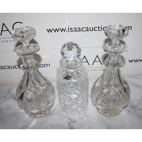 143 - Three Glass Decanters including a Pair

Collection Only