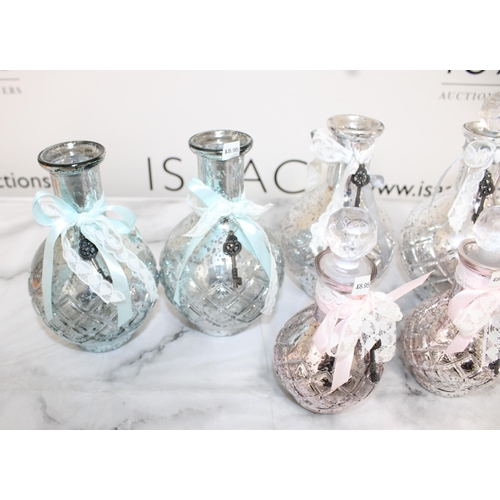 147 - Quantity of Glass Decorative Vases - Some Stoppers  - ( Stock From Jewellery Shop Clearance)

Larges... 