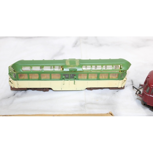 388 - Pair of Plastic Trams / Switches etc