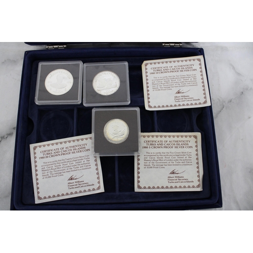 562 - Case Containing Three Coins With Certificates 1980 Silver Proof Coins