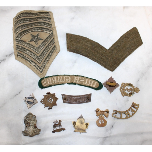 511 - Collection of Military Uniform insignia and Badges