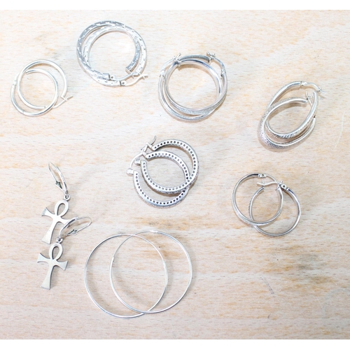 12 - Eight Pairs Of Silver Earrings