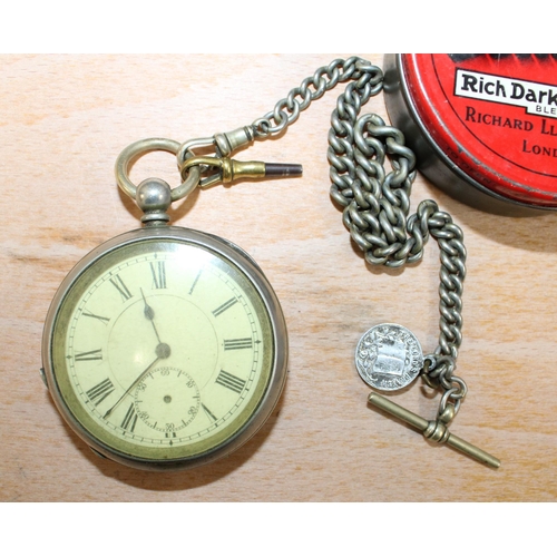 150 - Pocket Watch 5.5cm Diameter (Untested) In A Tin