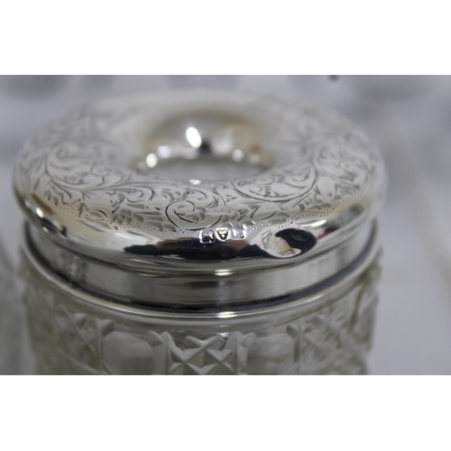 46 - Two Silver Hallmarked Topped Glass Jars & Silver Hallmarked Lid Total Weight Of Lids-49.14g
Tallest-... 