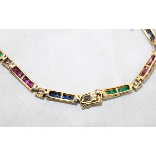 94 - 9k Gold KM Tennis Bracelet 20cm With Rubies, Emerald & Sapphires & Diamonds
In A Box
Weight-7.19g