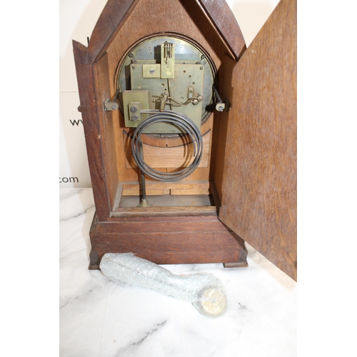 330 - Tall Antique Chiming Gothic Mantel Clock - Porcelain face and Roman Numerals. Includes Pendulum but ... 