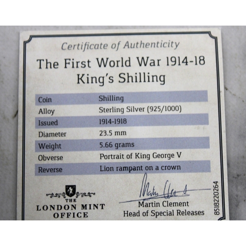 328 - Two collectable Coins Inc-
Boxed The First World War 1914-18 King's Shilling
D-DAY £5 Coin Presentat... 