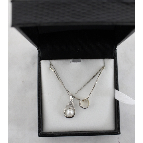 559 - Two 925 Silver Necklaces With Pendants In A Box