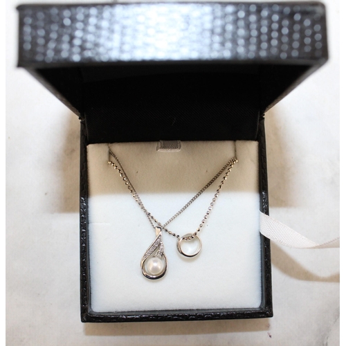 559 - Two 925 Silver Necklaces With Pendants In A Box