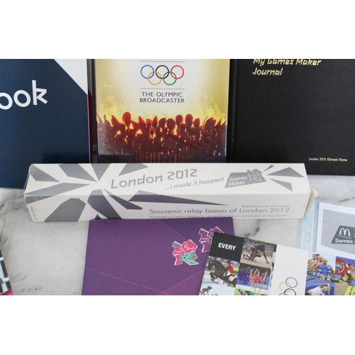 640 - Quantity Of London 2012 Volunteer Memorabilia
Including Swatch Watch in box and Badges ( Bronze, Sil... 