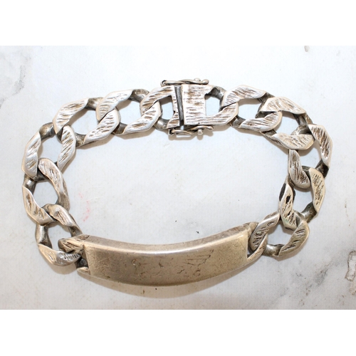 565 - Silver Hallmarked Identity Bracelet Weight-85.25g Length-23cm
Engraved Inside Shown In Pictures
In A... 