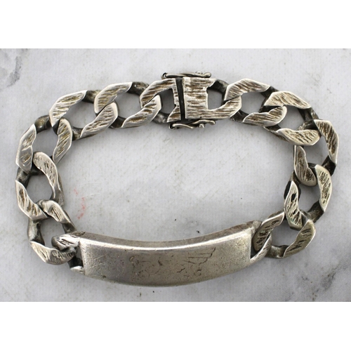 565 - Silver Hallmarked Identity Bracelet Weight-85.25g Length-23cm
Engraved Inside Shown In Pictures
In A... 