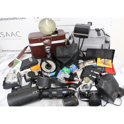 778 - Large Quantity of Camera Equipment including Cameras, Lenses, Cases and Accessories.