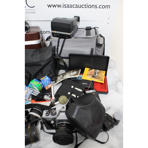 778 - Large Quantity of Camera Equipment including Cameras, Lenses, Cases and Accessories.