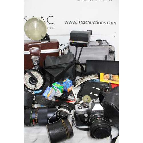 778 - Large Quantity of Camera Equipment including Cameras, Lenses, Cases and Accessories.