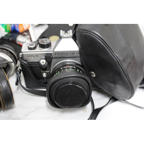 778 - Large Quantity of Camera Equipment including Cameras, Lenses, Cases and Accessories.