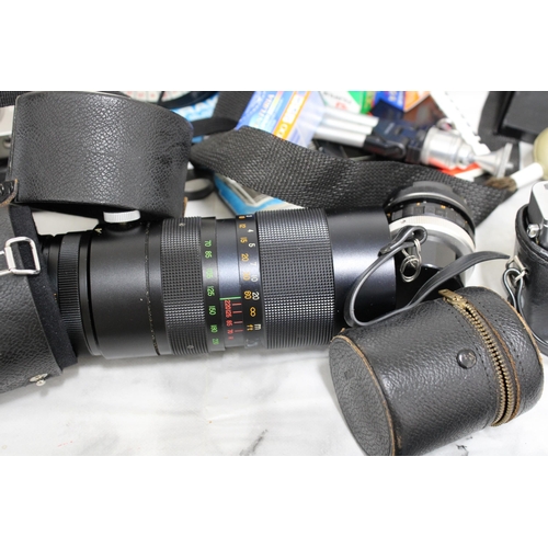 778 - Large Quantity of Camera Equipment including Cameras, Lenses, Cases and Accessories.