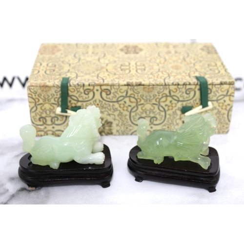 12 - Two Jade Fu Dogs On Stands Boxed
Including Stand Length 8cm