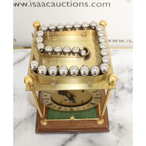 145 - Twaites & Reed Rolling Ball Clock c1950's - Measures 31cm High x 22cm Width

This lot is collection ... 