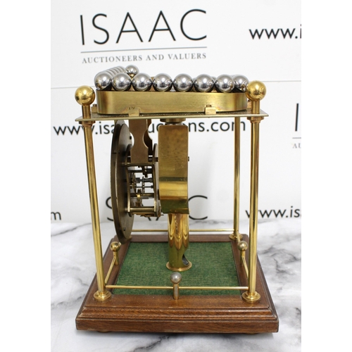 145 - Twaites & Reed Rolling Ball Clock c1950's - Measures 31cm High x 22cm Width

This lot is collection ... 