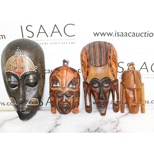 19 - Four Wooden Masks
All Proceeds Go To Charity