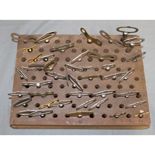 20 - Quantity Of Vintage Clock Keys In Wooden Base