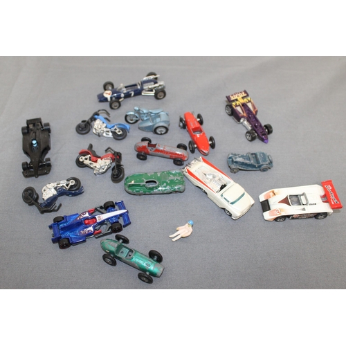 667 - A Collection Of Racing Cars And Motor bikes