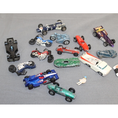 667 - A Collection Of Racing Cars And Motor bikes