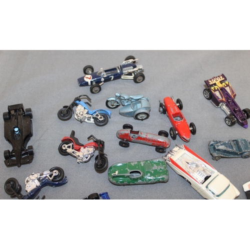 667 - A Collection Of Racing Cars And Motor bikes