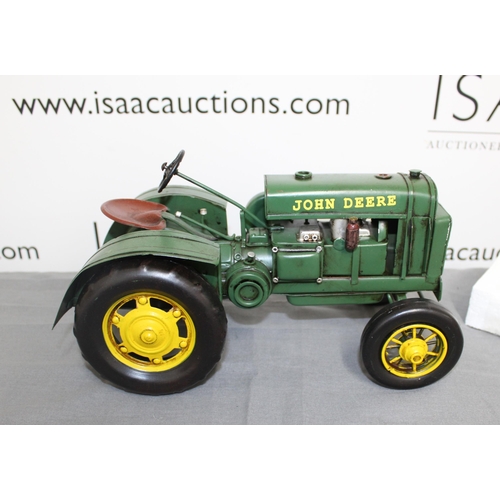 682 - Boxed Tin Plate 1931 John Deere Tractor
Length 31cm