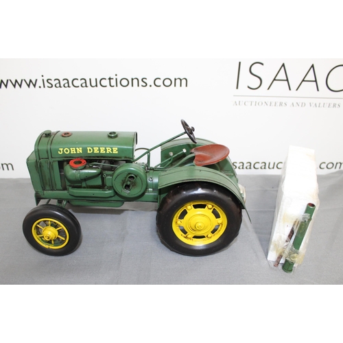 682 - Boxed Tin Plate 1931 John Deere Tractor
Length 31cm